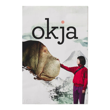 Poster of 'okja' with a person and a creature against a mountainous background